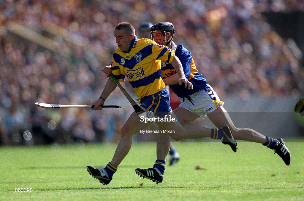 3 June 2001; Colin Lynch of Clare is dispossessed by Thomas Dunne of Tipperary during the Guinness Munster Senior Hurling Championship Semi-Final match between Tipperary and Clare at Páirc Uí Chaoimh in Cork. Photo by Brendan Moran/Sportsfile