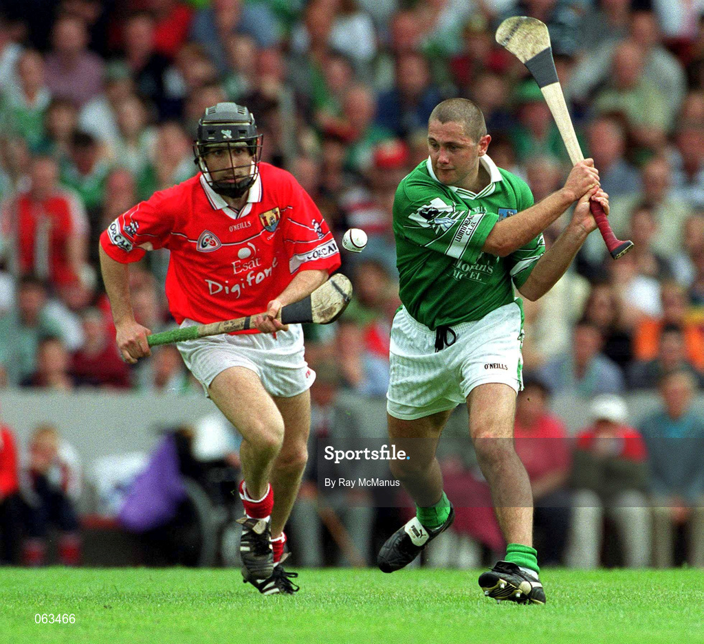 27 May 2001; Clement Smith of Limerick in action against Ben O'Connor of Cork during the Guinness Munster Senior Hurling Championship Quarter-Final match between Cork and Limerick at Páirc Uí Chaoimh in Cork. Photo by Ray McManus/Sportsfile