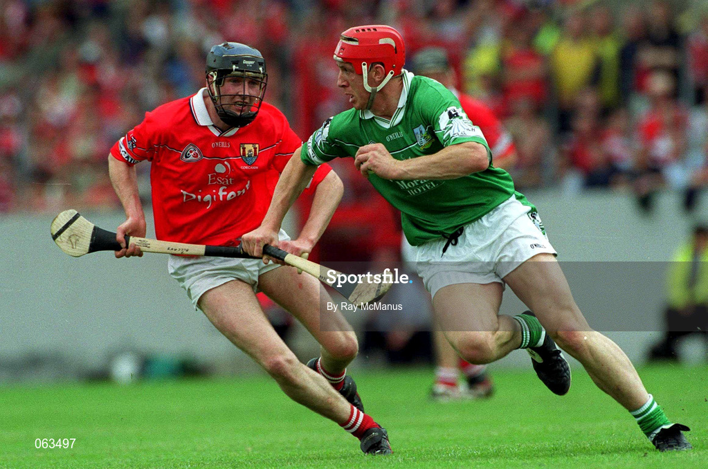 27 May 2001; Ollie Moran of Limerick is tackled by Pat Mulcahy of Cork during the Guinness Munster Senior Hurling Championship Quarter-Final match between Cork and Limerick at Páirc Uí Chaoimh in Cork. Photo by Ray McManus/Sportsfile