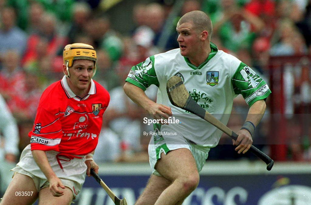 27 May 2001; Timmy Houlihan of Limerick in action against Joe Deane of Cork during the Guinness Munster Senior Hurling Championship Quarter-Final match between Cork and Limerick at Páirc Uí Chaoimh in Cork. Photo by Ray McManus/Sportsfile