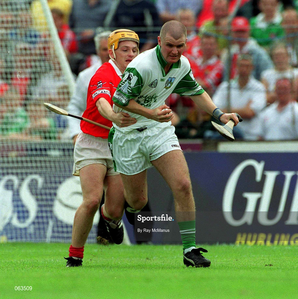 27 May 2001; Timmy Houlihan of Limerick in action against Joe Deane of Cork during the Guinness Munster Senior Hurling Championship Quarter-Final match between Cork and Limerick at Páirc Uí Chaoimh in Cork. Photo by Ray McManus/Sportsfile