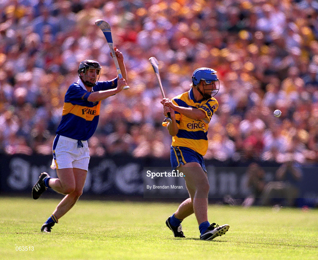 3 June 2001; Tony Carmody of Clare in action against Eddie Enright of Tipperary during the Guinness Munster Senior Hurling Championship Semi-Final match between Tipperary and Clare at Páirc Uí Chaoimh in Cork. Photo by Brendan Moran/Sportsfile