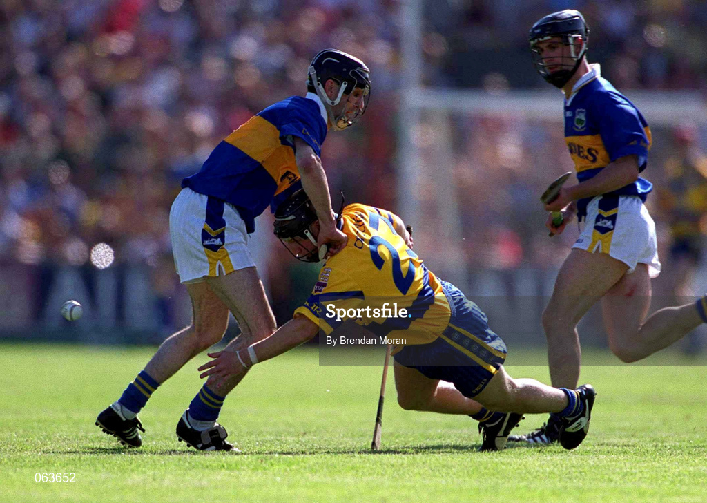 3 June 2001; Gearoid Considine of Clare clears the sliotar from Thomas Costello of Tipperary during the Guinness Munster Senior Hurling Championship Semi-Final match between Tipperary and Clare at Páirc Uí Chaoimh in Cork. Photo by Brendan Moran/Sportsfile