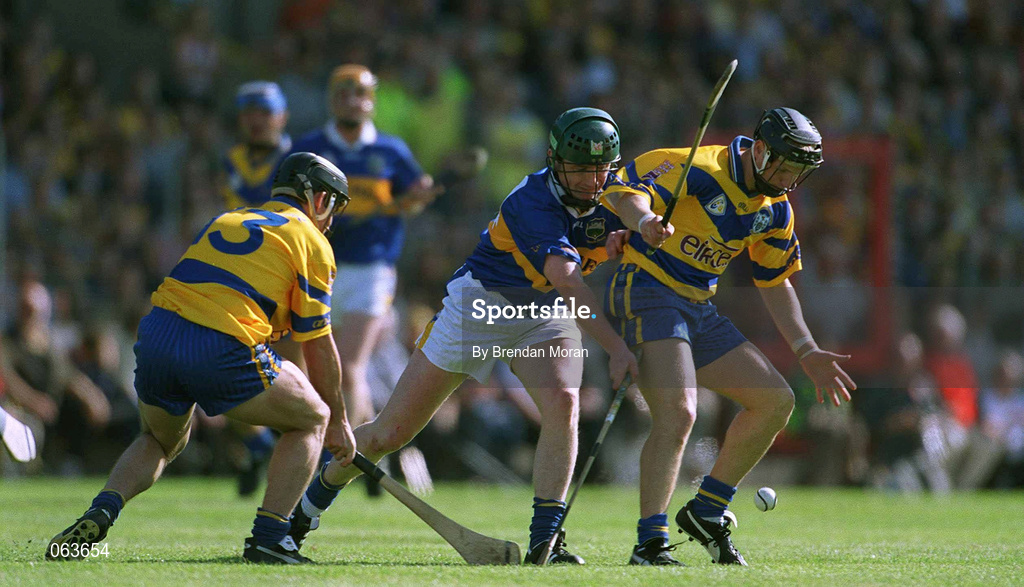 3 June 2001; Gearoid Considine of Clare is tackled by David Kennedy of Tipperary during the Guinness Munster Senior Hurling Championship Semi-Final match between Tipperary and Clare at Páirc Uí Chaoimh in Cork. Photo by Brendan Moran/Sportsfile