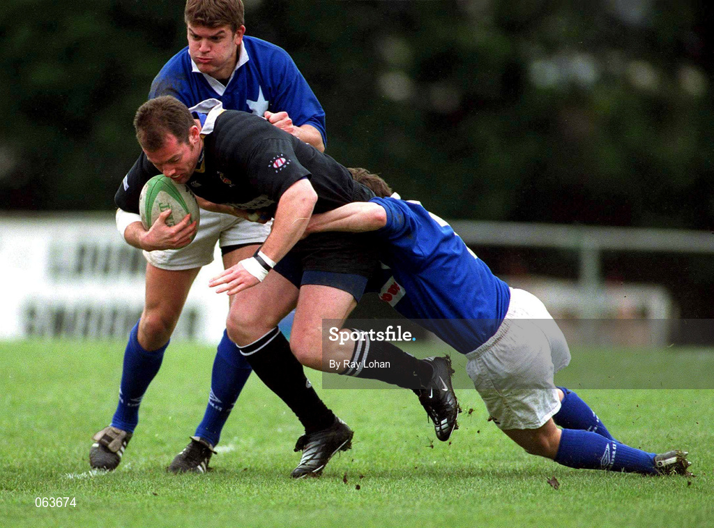 21 April 2001; James Topping of Ballymena is tackled by Eoin McCormack and John McWeeney of St Mary's College during the AIB All-Ireland League Division 1 match between St Mary's College and Ballymena at Templeville Road in Dublin. Photo by Ray Lohan/Sportsfile