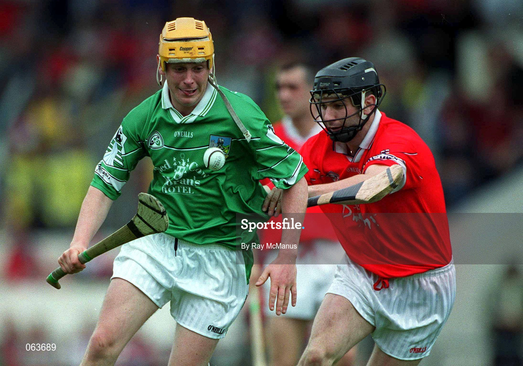 27 May 2001; Mark Tobin of Limerick in action against James Hughes of Cork during the Guinness Munster Senior Hurling Championship Quarter-Final match between Cork and Limerick at Páirc Uí Chaoimh in Cork. Photo by Ray McManus/Sportsfile