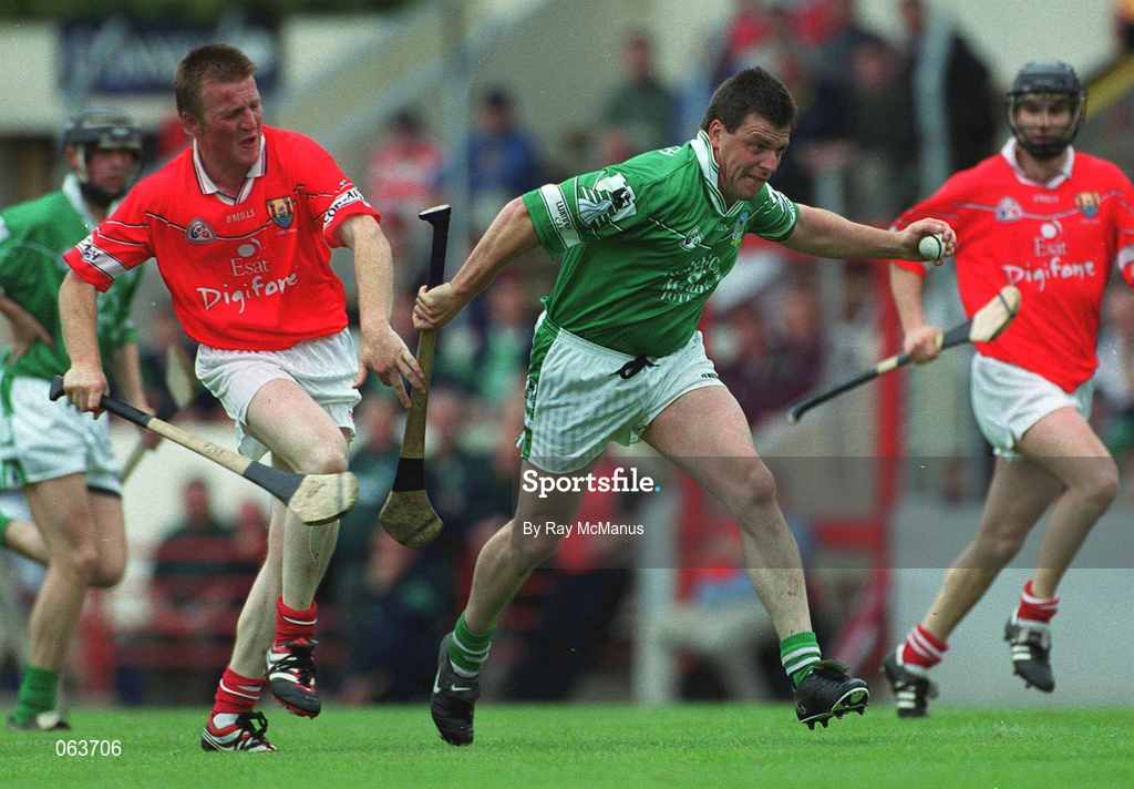 27 May 2001; PJ Garvey of Limerick in action against John O'Mahony of Cork during the Guinness Munster Senior Hurling Championship Quarter-Final match between Cork and Limerick at Páirc Uí Chaoimh in Cork. Photo by Ray McManus/Sportsfile