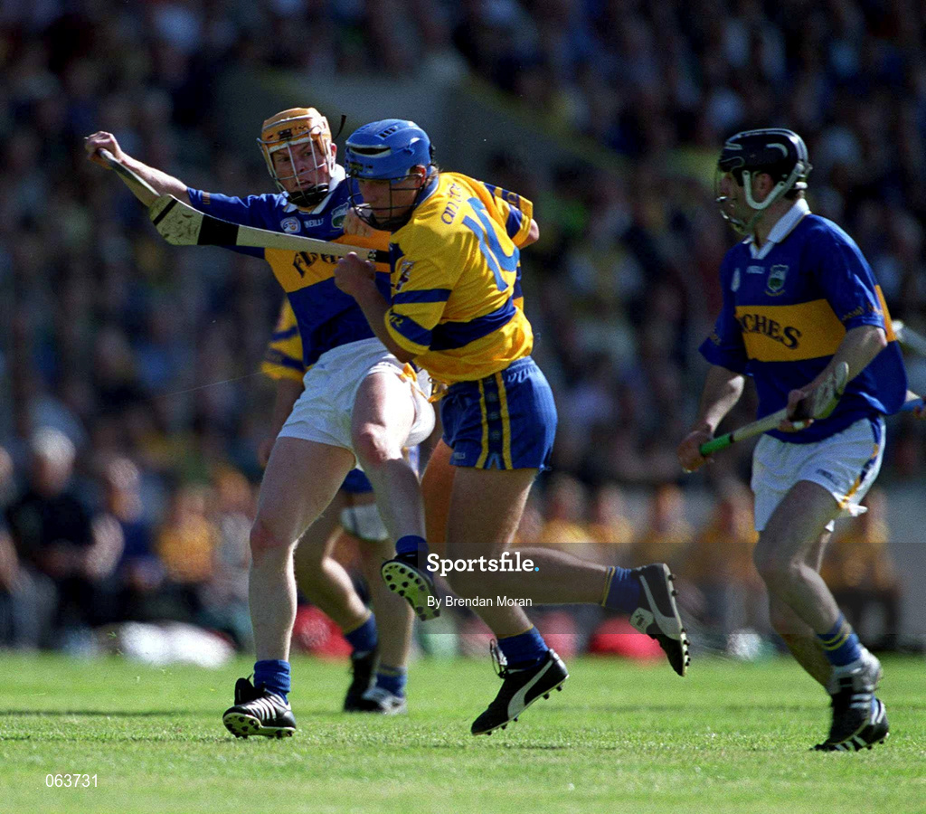 3 June 2001; Tony Carmody of Clare is tackled by Paul Ormonde of Tipperary during the Guinness Munster Senior Hurling Championship Semi-Final match between Tipperary and Clare at Páirc Uí Chaoimh in Cork. Photo by Brendan Moran/Sportsfile