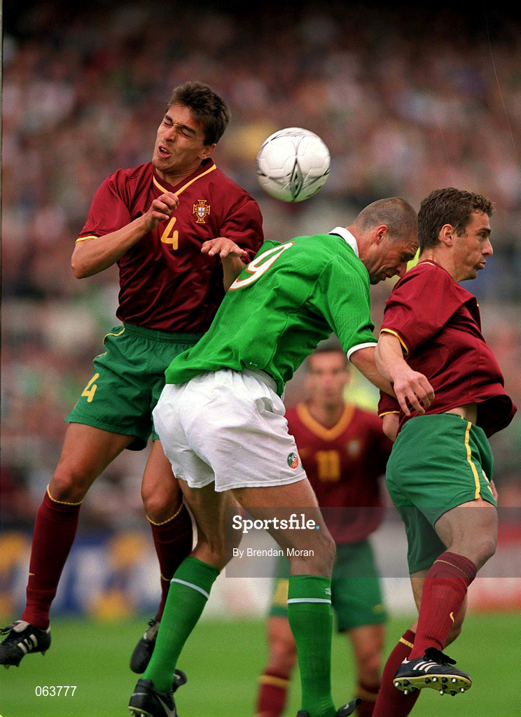2 June 2001; Niall Quinn of Republic of Ireland in action against Roberto 'Beto' Severo and Litos of Portugal during the FIFA World Cup 2002 Group 2 Qualifier match between Republic of Ireland and Portugal at Lansdowne Road in Dublin. Photo by Brendan Moran/Sportsfile