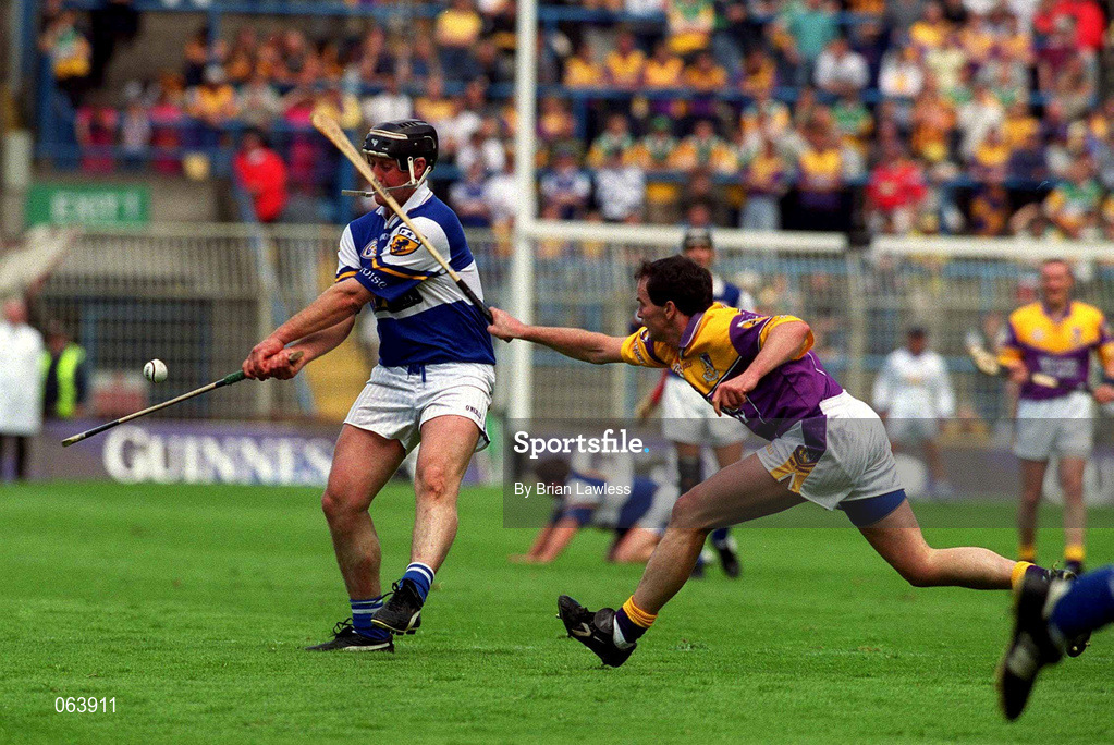 10 June 2001; David Cuddy of Laois in action against Adrian Fenlon of Wexford during the Guinness Leinster Senior Hurling Championship Semi-Final match between Wexford and Laois at Croke Park in Dublin. Photo by Brian Lawless/Sportsfile