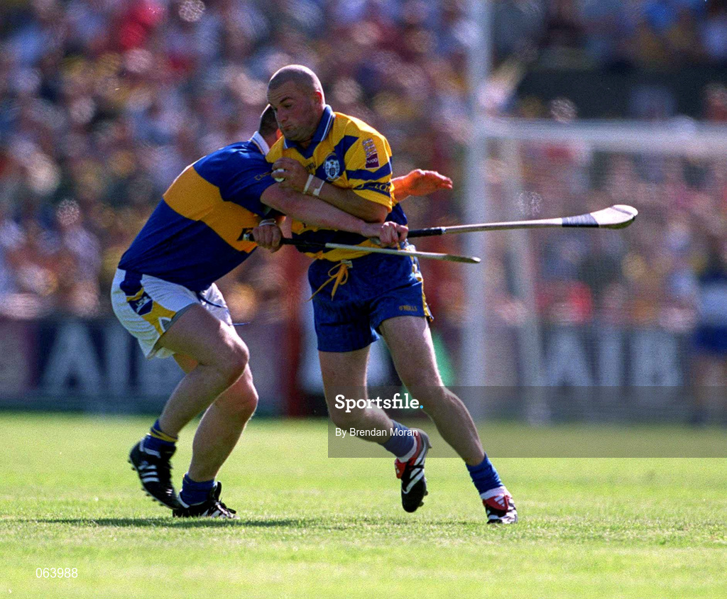 3 June 2001; Alan Markham of Clare in action against John Carroll of Tipperary during the Guinness Munster Senior Hurling Championship Semi-Final match between Tipperary and Clare at Páirc Uí Chaoimh in Cork. Photo by Brendan Moran/Sportsfile