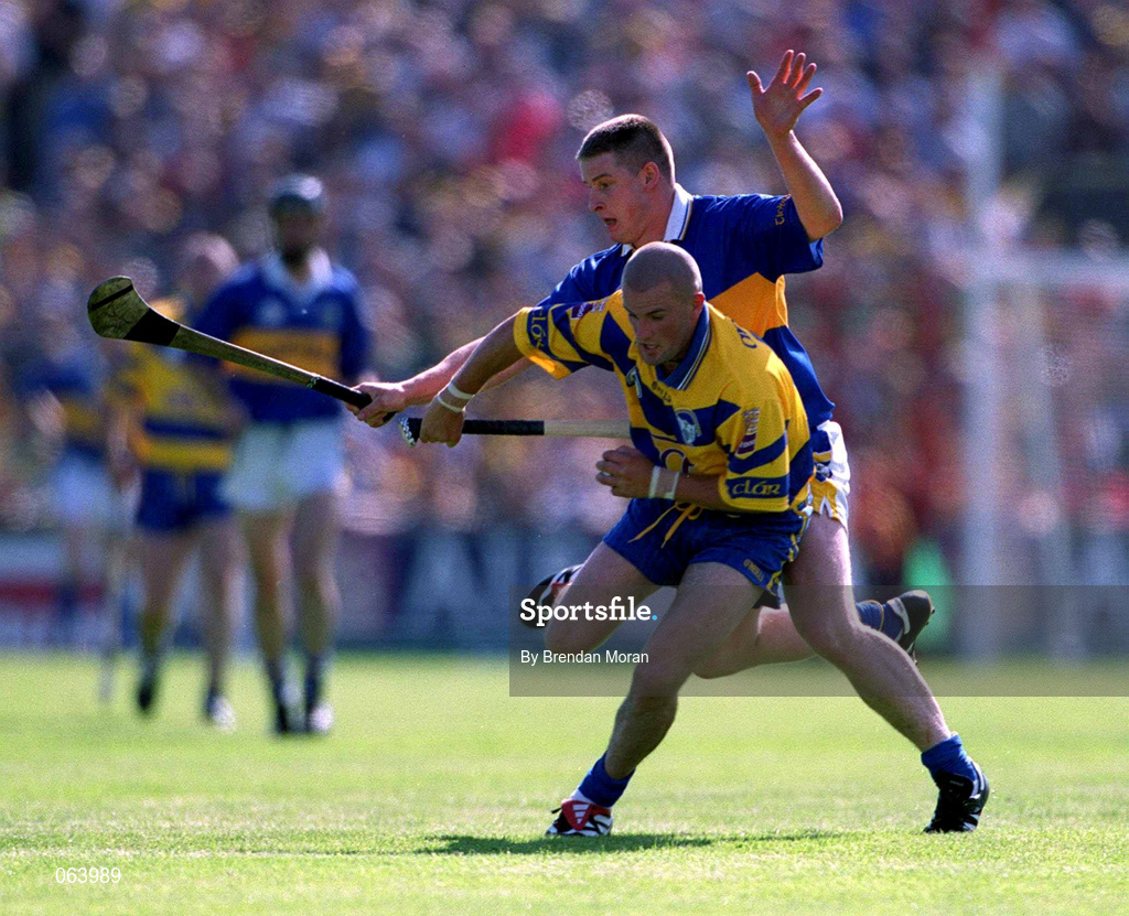 3 June 2001; Alan Markham of Clare in action against John Carroll of Tipperary during the Guinness Munster Senior Hurling Championship Semi-Final match between Tipperary and Clare at Páirc Uí Chaoimh in Cork. Photo by Brendan Moran/Sportsfile