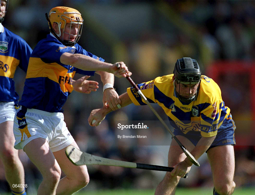 3 June 2001; David Forde of Clare is tackled by Paul Ormonde of Tipperary during the Guinness Munster Senior Hurling Championship Semi-Final match between Tipperary and Clare at Páirc Uí Chaoimh in Cork. Photo by Brendan Moran/Sportsfile