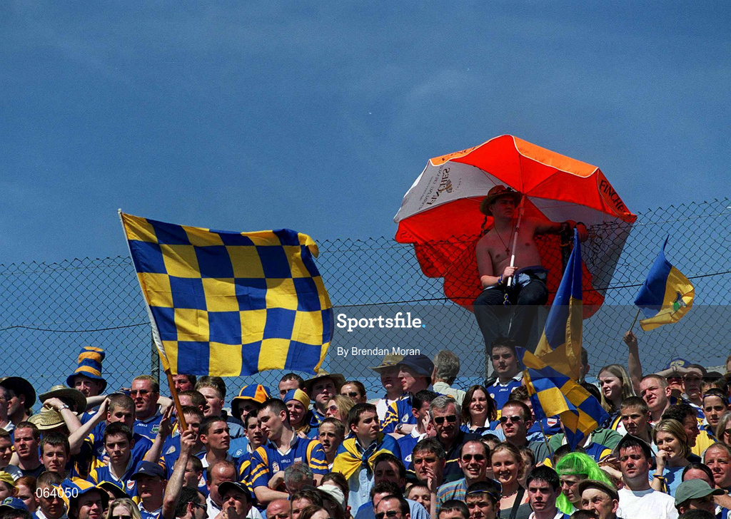 3 June 2001; A Tipperary fan shields himself from the sun with an umbrella during the Guinness Munster Senior Hurling Championship Semi-Final match between Tipperary and Clare at Páirc Uí Chaoimh in Cork. Photo by Brendan Moran/Sportsfile