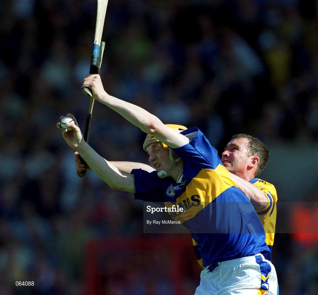 3 June 2001; Lar Corbett of Clare in action against Brian Quinn of Tipperary during the Guinness Munster Senior Hurling Championship Semi-Final match between Tipperary and Clare at Páirc Uí Chaoimh in Cork. Photo by Ray McManus/Sportsfile
