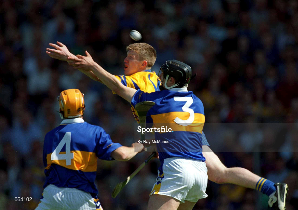 3 June 2001; Niall Gilligan of Clare in action against Philip Maher, 4, of Tipperary during the Guinness Munster Senior Hurling Championship Semi-Final match between Tipperary and Clare at Páirc Uí Chaoimh in Cork. Photo by Ray McManus/Sportsfile