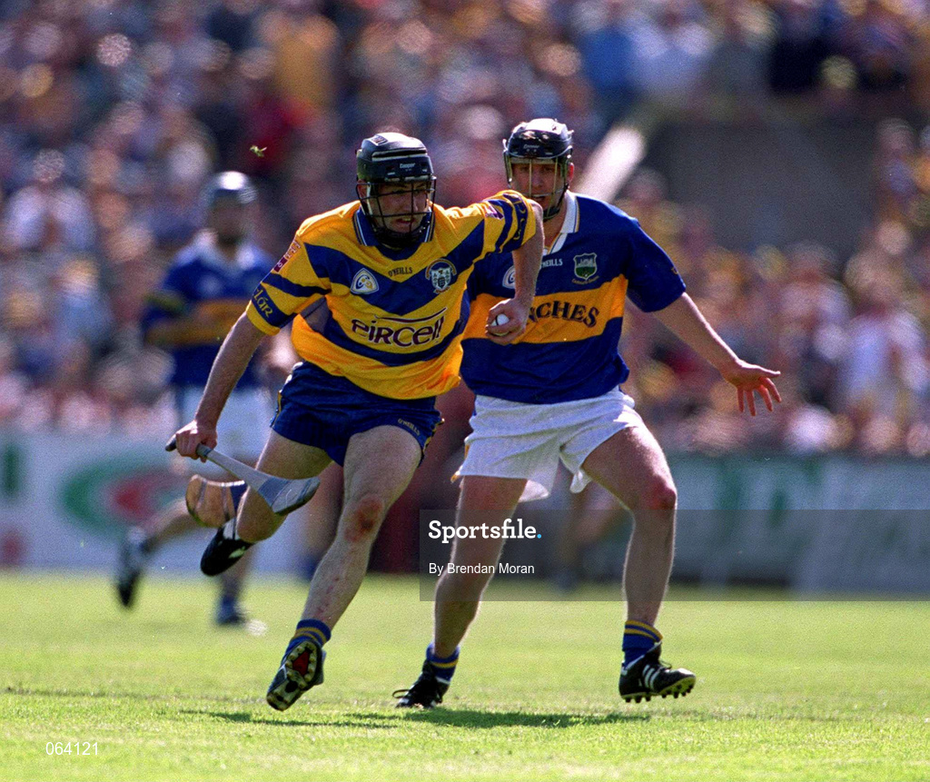 3 June 2001; Sean McMahon of Clare in action against Eddie Enright of Tipperary during the Guinness Munster Senior Hurling Championship Semi-Final match between Tipperary and Clare at Páirc Uí Chaoimh in Cork. Photo by Brendan Moran/Sportsfile