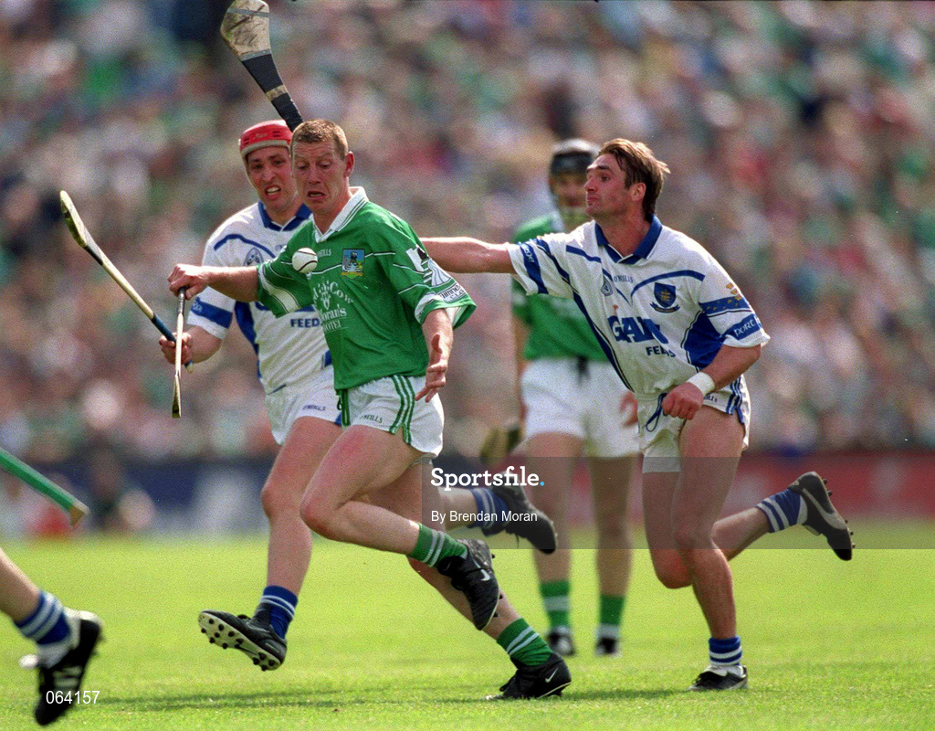 10 June 2001; Ciaran Carey of Limerick in action against Tony Browne and Johnny Brenner of Waterford during the Guinness Munster Senior Hurling Championship Semi-Final match between Limerick and Waterford at Páirc Uí Chaoimh in Cork. Photo by Brendan Moran/Sportsfile