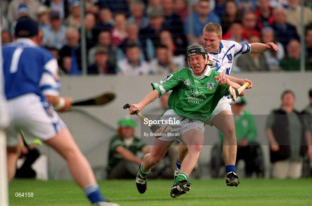 10 June 2001; James Butler of Limerick in action against Brian Flannery of Waterford during the Guinness Munster Senior Hurling Championship Semi-Final match between Limerick and Waterford at Páirc Uí Chaoimh in Cork. Photo by Brendan Moran/Sportsfile