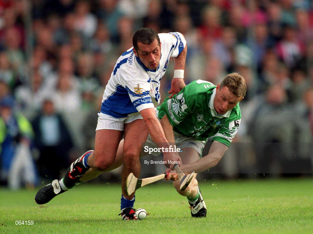 10 June 2001; Eoin O'Neill of Limerick in action against Peter Queally of Waterford during the Guinness Munster Senior Hurling Championship Semi-Final match between Limerick and Waterford at Páirc Uí Chaoimh in Cork. Photo by Brendan Moran/Sportsfile