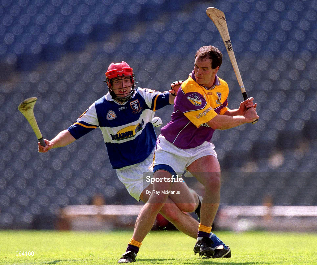 10 June 2001; Adrian Fenlon of Wexford in action against James Young of Laois during the Guinness Leinster Senior Hurling Championship Semi-Final match between Wexford and Laois at Croke Park in Dublin. Photo by Ray McManus/Sportsfile
