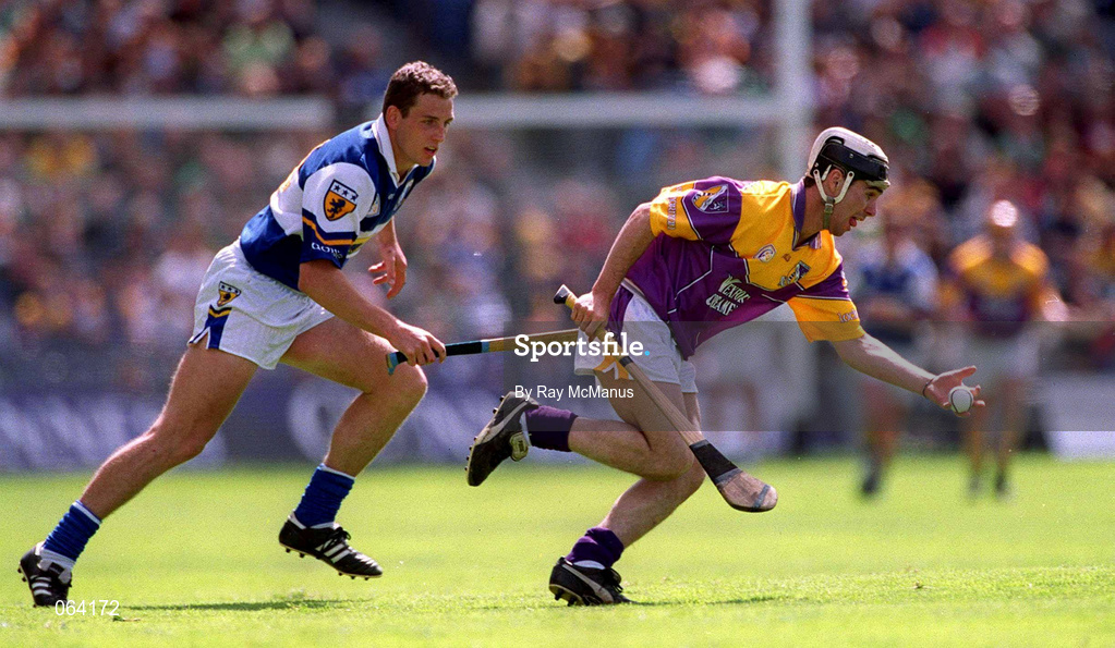 10 June 2001; Rory McCarthy of Wexford in action against Darren Rooney of Laois during the Guinness Leinster Senior Hurling Championship Semi-Final match between Wexford and Laois at Croke Park in Dublin. Photo by Ray McManus/Sportsfile