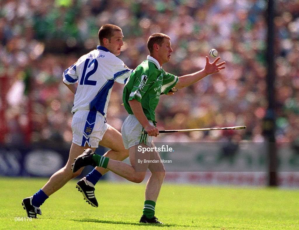 10 June 2001; Ciaran Carey of Limerick is tackled by Ken McGrath of Waterford during the Guinness Munster Senior Hurling Championship Semi-Final match between Limerick and Waterford at Páirc Uí Chaoimh in Cork. Photo by Brendan Moran/Sportsfile