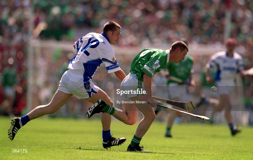 10 June 2001; Ciaran Carey of Limerick is tackled by Ken McGrath of Waterford during the Guinness Munster Senior Hurling Championship Semi-Final match between Limerick and Waterford at Páirc Uí Chaoimh in Cork. Photo by Brendan Moran/Sportsfile