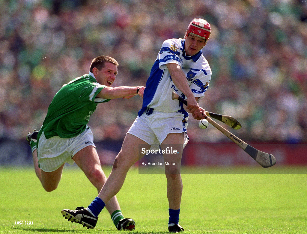 10 June 2001; Michael White of Waterford in action against Mark Foley of Limerick during the Guinness Munster Senior Hurling Championship Semi-Final match between Limerick and Waterford at Páirc Uí Chaoimh in Cork. Photo by Brendan Moran/Sportsfile
