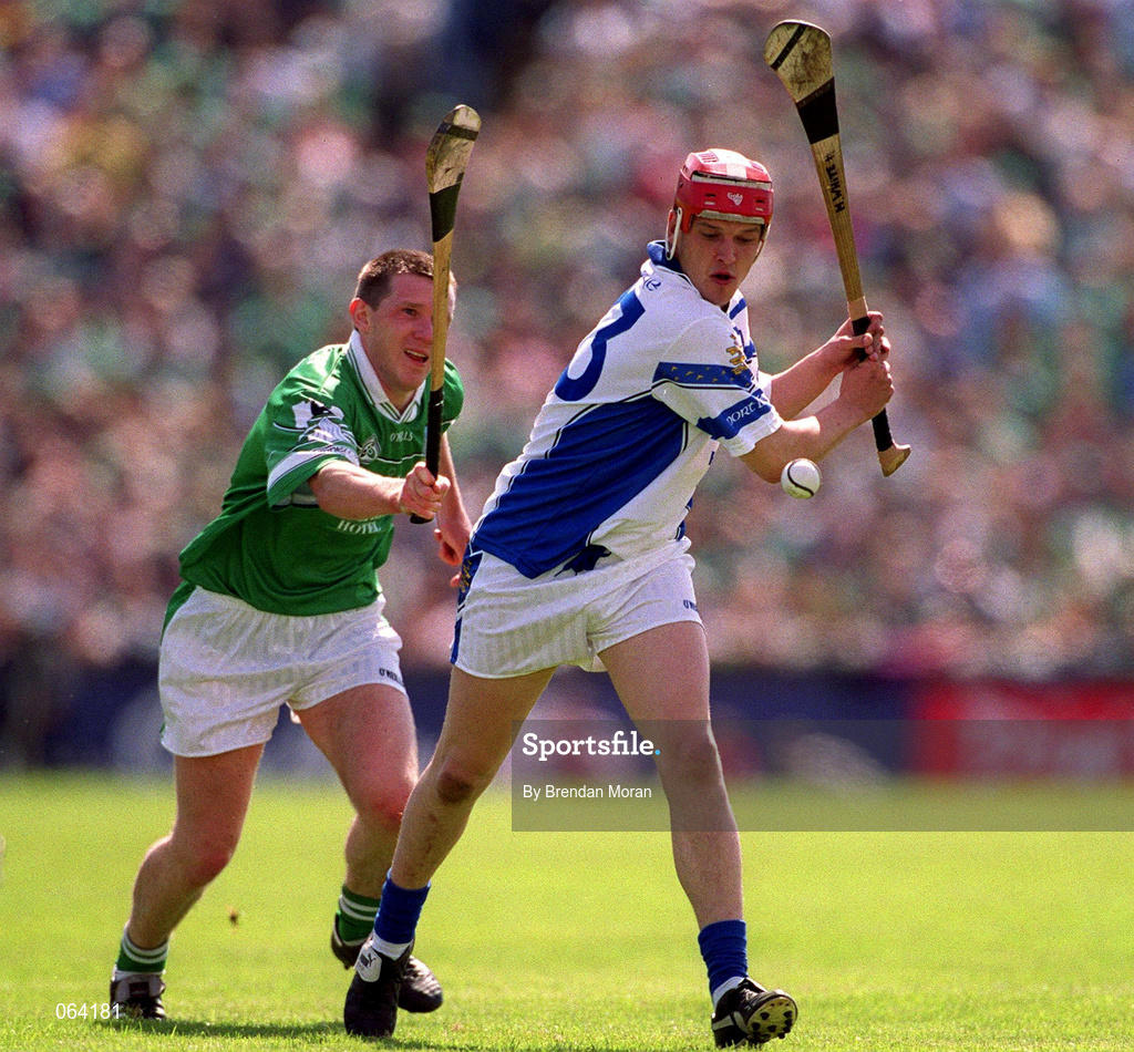 10 June 2001; Michael White of Waterford in action against Mark Foley of Limerick during the Guinness Munster Senior Hurling Championship Semi-Final match between Limerick and Waterford at Páirc Uí Chaoimh in Cork. Photo by Brendan Moran/Sportsfile