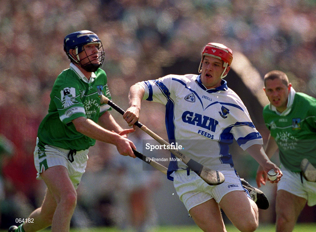 10 June 2001; Michael White of Waterford in action against Brian Geary of Limerick during the Guinness Munster Senior Hurling Championship Semi-Final match between Limerick and Waterford at Páirc Uí Chaoimh in Cork. Photo by Brendan Moran/Sportsfile