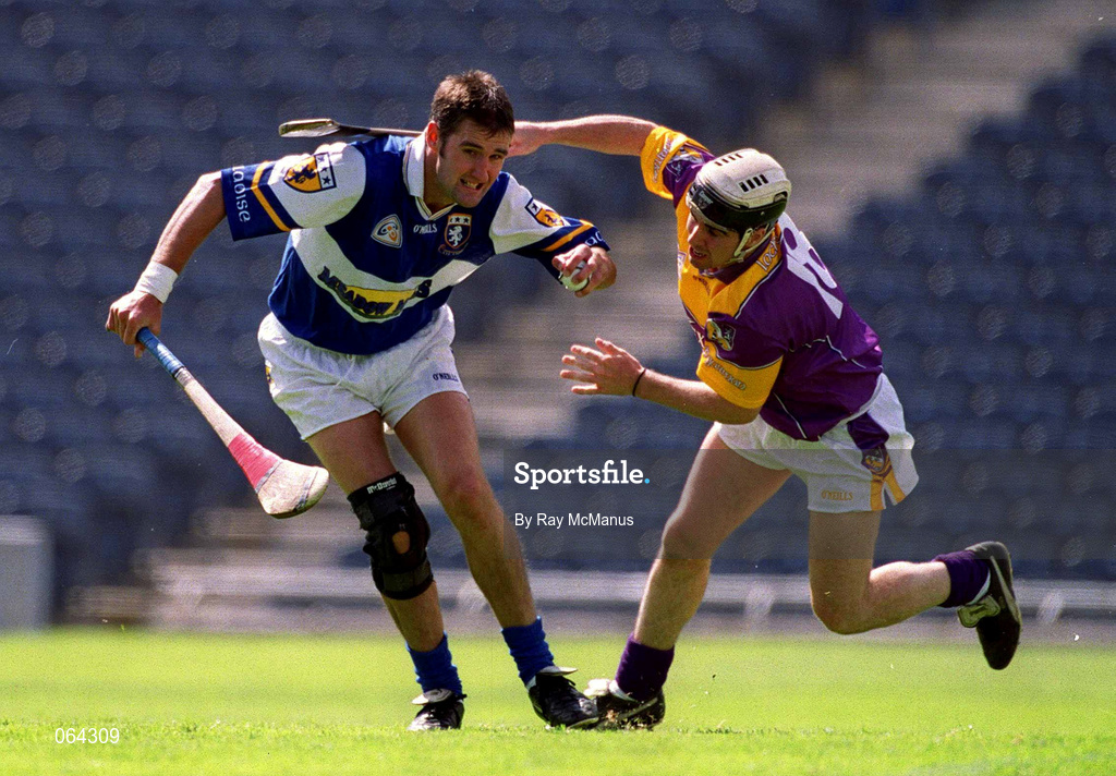 10 June 2001; Paul Cuddy of Laois in action against Ken Furlong of Wexford during the Guinness Leinster Senior Hurling Championship Semi-Final match between Wexford and Laois at Croke Park in Dublin. Photo by Ray McManus/Sportsfile