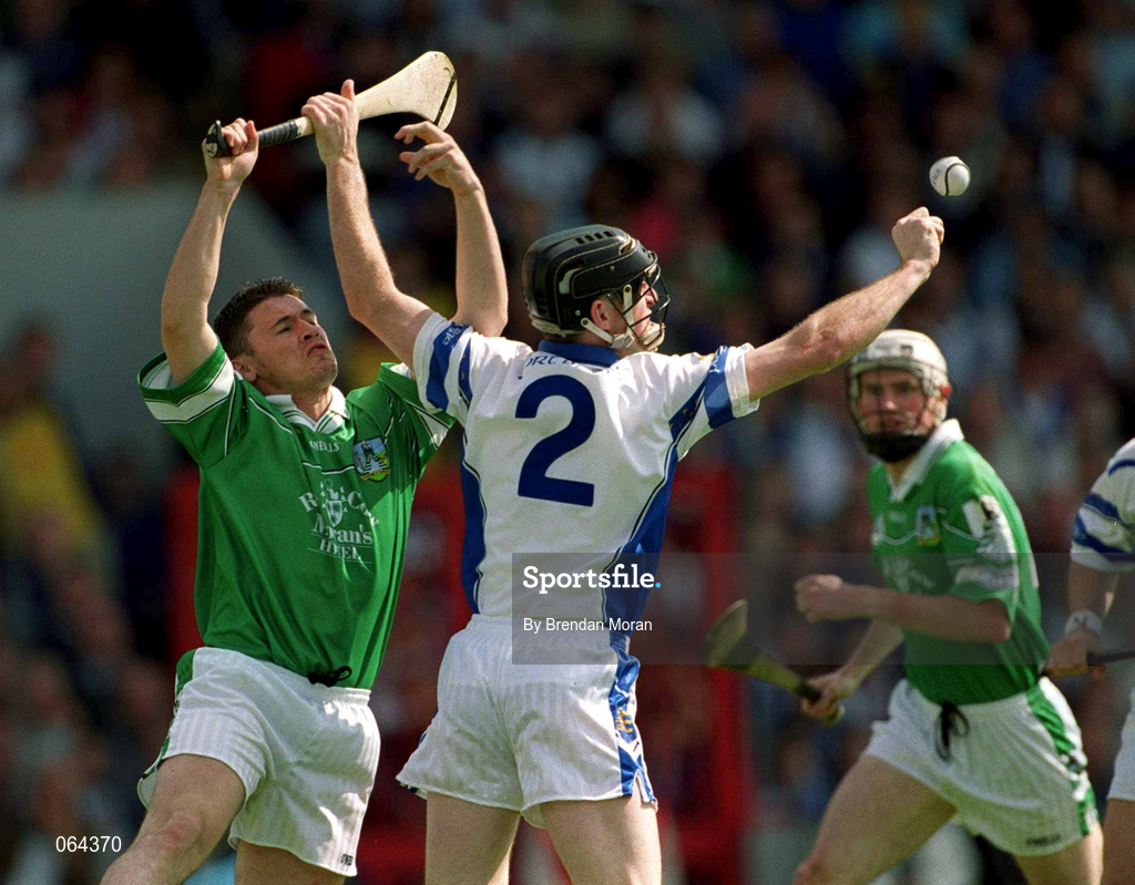 10 June 2001; Barry Foley of Limerick in action against Tom Feeney of Waterford during the Guinness Munster Senior Hurling Championship Semi-Final match between Limerick and Waterford at Páirc Uí Chaoimh in Cork. Photo by Brendan Moran/Sportsfile