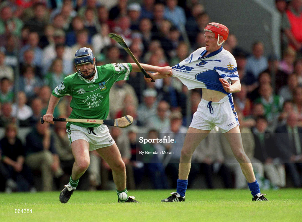 10 June 2001; Brian Geary of Limerick in action against James Mullane of Waterford during the Guinness Munster Senior Hurling Championship Semi-Final match between Limerick and Waterford at Páirc Uí Chaoimh in Cork. Photo by Brendan Moran/Sportsfile