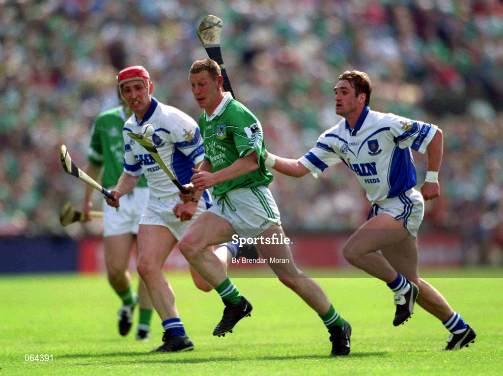 10 June 2001; Ciaran Carey of Limerick in action against Tony Browne, right, and Johnny Brenner of Waterford during the Guinness Munster Senior Hurling Championship Semi-Final match between Limerick and Waterford at Páirc Uí Chaoimh in Cork. Photo by Brendan Moran/Sportsfile