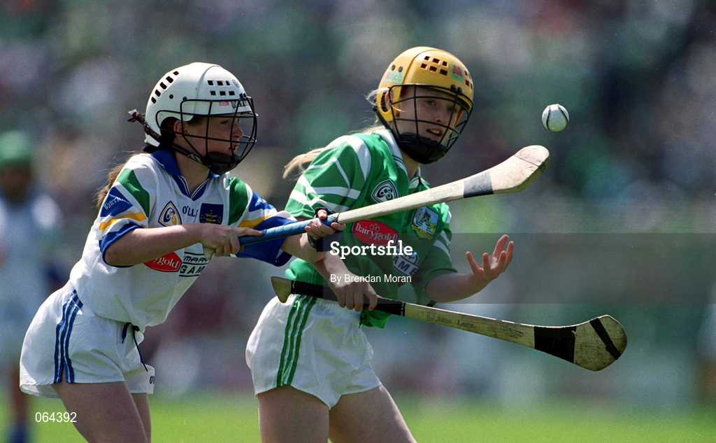 10 June 2001; Cliona Lane of Limerick in action against Ciarra Murray of Waterford during the DairyGold Munster Hurling Primary Schools game between Limerick and Waterford at half-time of the Guinness Munster Senior Hurling Championship Semi-Final match between Limerick and Waterford at Páirc Uí Chaoimh in Cork. Photo by Brendan Moran/Sportsfile