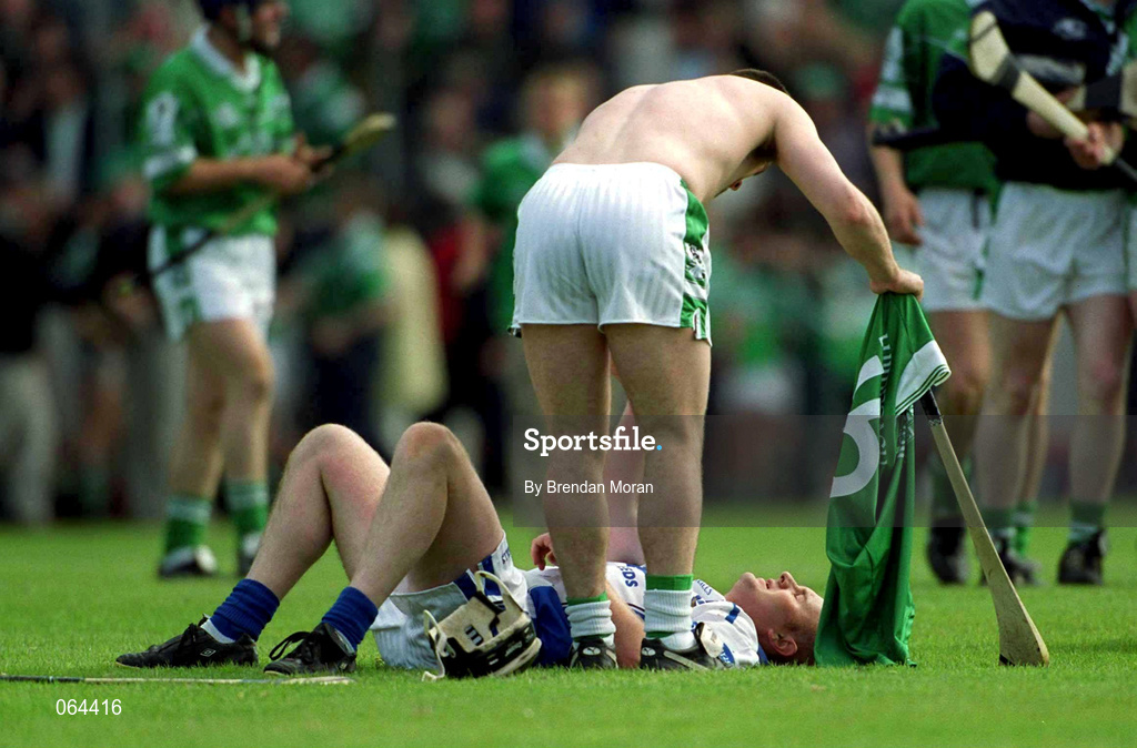 10 June 2001; Fergal Hartley of Waterford is consoled by Limerick captain Barry Foley following the Guinness Munster Senior Hurling Championship Semi-Final match between Limerick and Waterford at Páirc Uí Chaoimh in Cork. Photo by Brendan Moran/Sportsfile