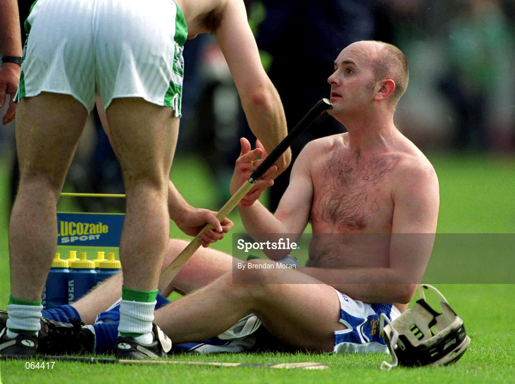 10 June 2001; Fergal Hartley of Waterford is consoled following the Guinness Munster Senior Hurling Championship Semi-Final match between Limerick and Waterford at Páirc Uí Chaoimh in Cork. Photo by Brendan Moran/Sportsfile