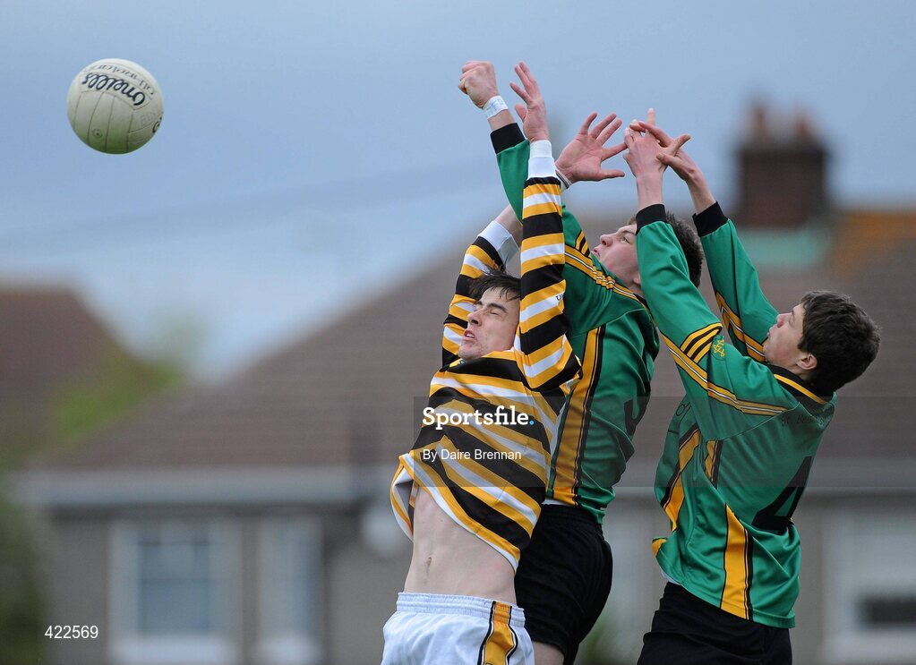 4 May 2010; Aodhán Clabby, St Benildus College, punches the ball away from team-mate Karl McGrath, right, and Sean Mac Cratih, Colaiste Eoin. Dublin School Senior Football A Final, St Benildus College v Colaiste Eoin, O'Toole Park, Crumlin, Dublin. Picture credit: Dáire Brennan / SPORTSFILE