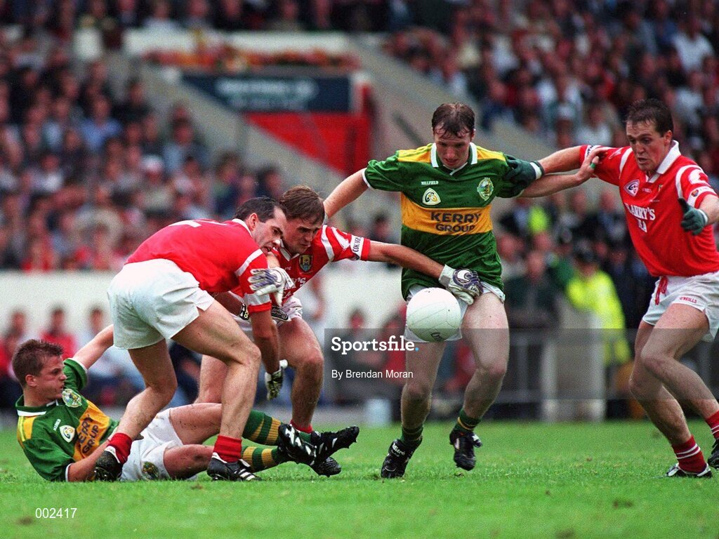 21 July 1996; Gene 'Bingo' Driscoll, Kerry, in action against Mark O'Connor, left, Michael O'Donovan and Ciaran O'Sullivan, Cork. Munster Senior Football Championship Final, Kerry v Cork, Pairc ui Chaoimh, Cork. Picture credit: Brendan Moran / SPORTSFILE