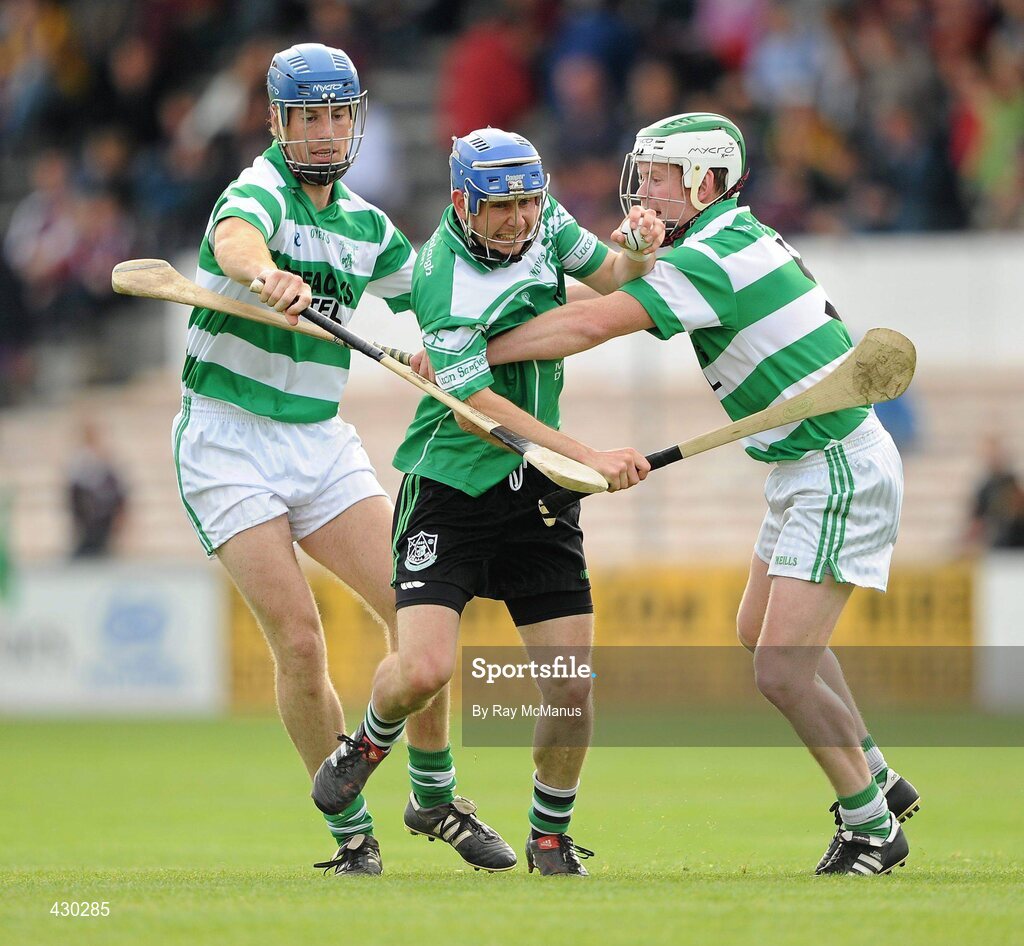 29 May 2010; Mick May, Lucan Sarsfields, is tackled by Shamrocks' defenders Anthony Wallace, right, and Barry McGee. Leinster GAA Club Hurling League Division 2 Final, Shamrocks, Wexford, v Lucan Sarsfields, Dublin, Nowlan Park, Kilkenny. Picture credit: Ray McManus / SPORTSFILE