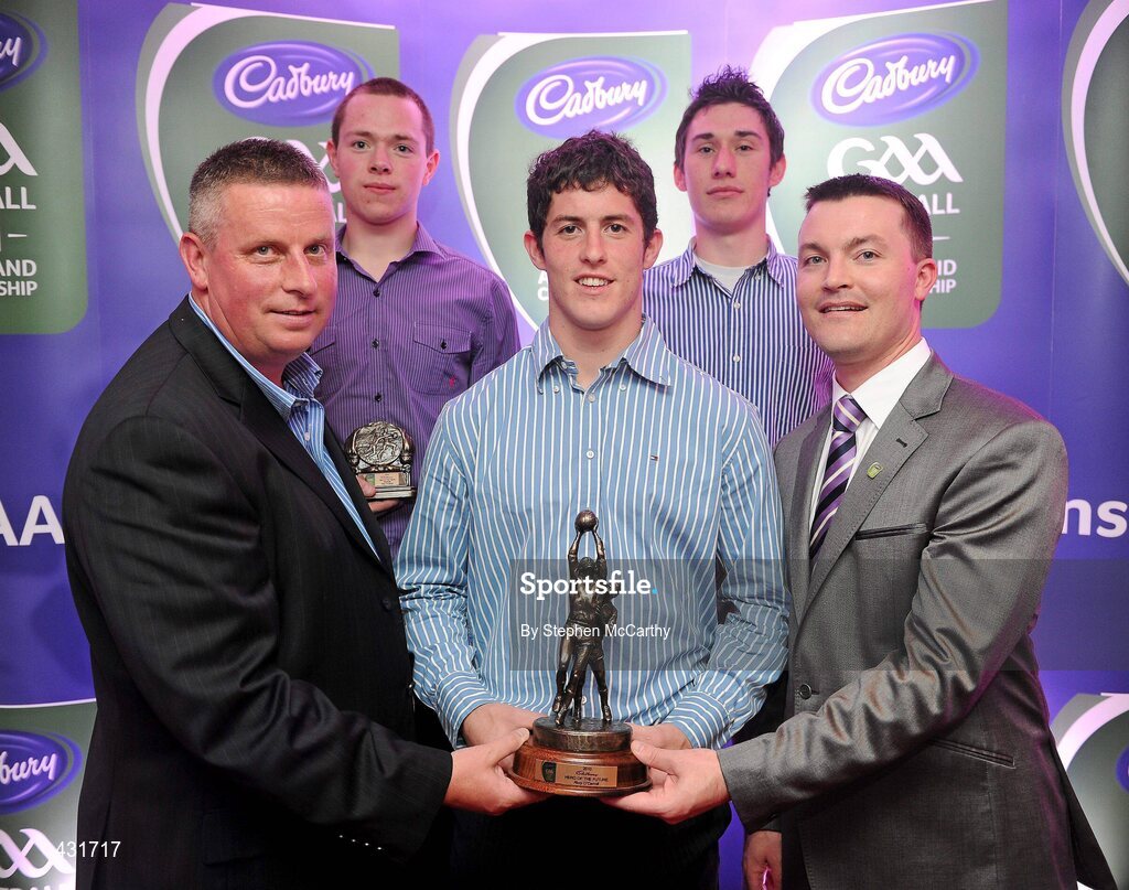 2 June 2010; Shane Guest, Senior Brand Manager, Cadbury Ireland, and 2010 Cadbury Hero of the Future judge and former Dublin manager Paul Caffrey with 2010 Cadbury Hero of the Future Award winner Rory O'Carroll, centre, and fellow Dublin footballers Dean Rock, left, and Nicky Devereux. Rory, Dean and Nicky were three of 14 shortlisted players who had excelled throughout the 2010 Cadbury GAA U21 Football Championship, all nominees can be seen on www.cadburygaau21.com Past winners include Colm O’Neill and Fintan Goold from Cork, Killian Young from Kerry and Keith Higgins from Mayo and all have gone on to represent their counties at senior level. Rory, who plays his club football with Kilmacud Crokes, was named as a Cadbury Hero of the Match for his performance against Donegal in the All Ireland Final. The judging panel which consisted of senior Kildare footballer Dermot Earley, former Dublin manager Paul Caffrey and TG4 journalist Michael O’Domhnaill, gave serious consideration to the public vote which saw over 5,000 votes cast on cadburygaau21.com, but ultimately Rory O’Carroll’s heroic performances in both the semi-final against Roscommon and the final against Donegal, where he faced two of the Ireland’s most talented footballers meant he edged the competition out in the end. Cadbury Under 21 Hero of the Future Awards, Croke Park, Dublin. Picture credit: Stephen McCarthy / SPORTSFILE