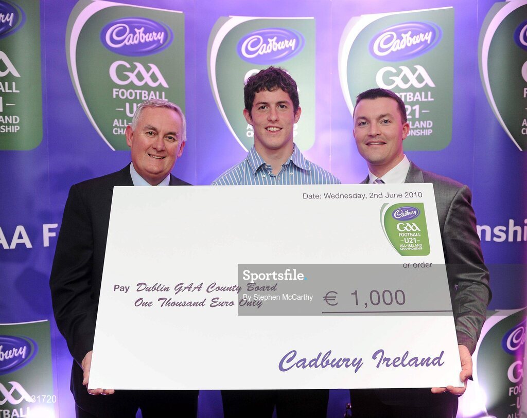 2 June 2010; Uachtarán Chumann Lúthchleas Gael Criostóir Ó Cuana and Shane Guest, Senior Brand Manager, Cadbury Ireland, presenting Dublin footballer Rory O'Carroll, 2010 Cadbury Hero of the Future Award Winner, with a €1,000 cheque for the Dublin GAA County Board, as part of his prize. Rory was one of 14 shortlisted players who had excelled throughout the 2010 Cadbury GAA U21 Football Championship, all nominees can be seen on www.cadburygaau21.com Past winners include Colm O’Neill and Fintan Goold from Cork, Killian Young from Kerry and Keith Higgins from Mayo and all have gone on to represent their counties at senior level. Rory, who plays his club football with Kilmacud Crokes, was named as a Cadbury Hero of the Match for his performance against Donegal in the All Ireland Final. The judging panel which consisted of senior Kildare footballer Dermot Earley, former Dublin manager Paul Caffrey and TG4 journalist Michael O’Domhnaill, gave serious consideration to the public vote which saw over 5,000 votes cast on cadburygaau21.com, but ultimately Rory O’Carroll’s heroic performances in both the semi-final against Roscommon and the final against Donegal, where he faced two of the Ireland’s most talented footballers meant he edged the competition out in the end. Cadbury Under 21 Hero of the Future Awards, Croke Park, Dublin. Picture credit: Stephen McCarthy / SPORTSFILE