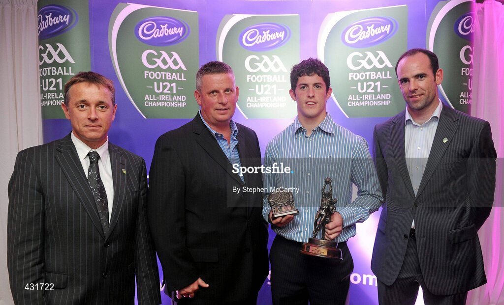 2 June 2010; Cadbury Hero of the Future Award judges, from left, TG4 journalist Michael O’Domhnaill, former Dublin manager Paul Caffrey and senior Kildare footballer Dermot Earley, right, with Dublin footballer Rory O'Carroll, the 2010 Cadbury Hero of the Future Award winner. Rory was one of 14 shortlisted players who had excelled throughout the 2010 Cadbury GAA U21 Football Championship, all nominees can be seen on www.cadburygaau21.com Past winners include Colm O’Neill and Fintan Goold from Cork, Killian Young from Kerry and Keith Higgins from Mayo and all have gone on to represent their counties at senior level. Rory, who plays his club football with Kilmacud Crokes, was named as a Cadbury Hero of the Match for his performance against Donegal in the All Ireland Final. The judging panel which consisted of senior Kildare footballer Dermot Earley, former Dublin manager Paul Caffrey and TG4 journalist Michael O’Domhnaill, gave serious consideration to the public vote which saw over 5,000 votes cast on cadburygaau21.com, but ultimately Rory O’Carroll’s heroic performances in both the semi-final against Roscommon and the final against Donegal, where he faced two of the Ireland’s most talented footballers meant he edged the competition out in the end. Cadbury Under 21 Hero of the Future Awards, Croke Park, Dublin. Picture credit: Stephen McCarthy / SPORTSFILE