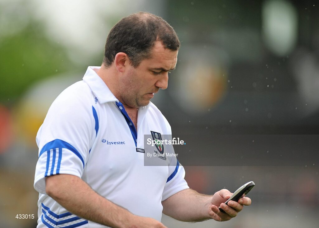 6 June 2010; Monaghan manager Seamus McEnaney checks his phone before the start of the game. Ulster GAA Football Senior Championship Quarter-Final, Monaghan v Armagh, Casement Park, Belfast, Co. Antrim. Picture credit: David Maher / SPORTSFILE