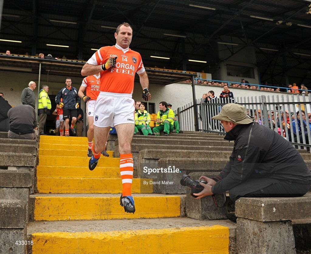 6 June 2010; Armagh captain Steven McDonnell leads his team out onto the pitch for the start of the game. Ulster GAA Football Senior Championship Quarter-Final, Monaghan v Armagh, Casement Park, Belfast, Co. Antrim. Picture credit: David Maher / SPORTSFILE