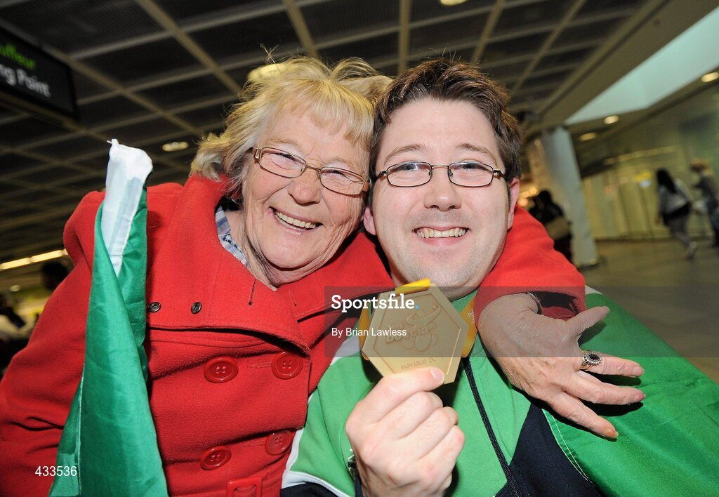 10 June 2010; Padraic Moran, from Bray, Co. Wicklow, celebrates with his mother Catherine Moran, on his return to Ireland after winning Gold in the BC1 Class at the CPISRA World Boccia Championships in Lisbon. The Bray local, sensationally beat home favourite Portugal’s Joao Paolo Fernandez by a score of 3:2 in a thrilling final at the Estádio Universitário in Lisbon’s University complex to take victory This is the end of a long Championship for Moran who earlier in the week led the Irish team to a 4th place finish in the BC1/BC2 combined team competition. Dublin Airport, Dublin. Picture credit: Brian Lawless / SPORTSFILE