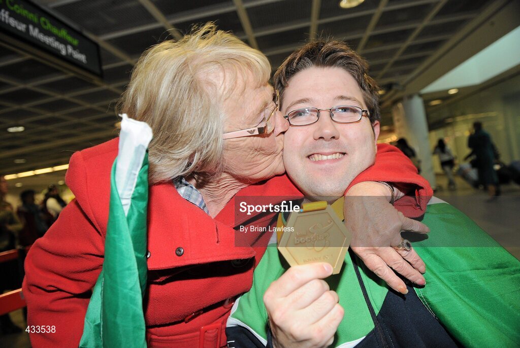 10 June 2010; Padraic Moran, from Bray, Co. Wicklow, celebrates with his mother Catherine Moran, on his return to Ireland after winning Gold in the BC1 Class at the CPISRA World Boccia Championships in Lisbon. The Bray local, sensationally beat home favourite Portugal’s Joao Paolo Fernandez by a score of 3:2 in a thrilling final at the Estádio Universitário in Lisbon’s University complex to take victory This is the end of a long Championship for Moran who earlier in the week led the Irish team to a 4th place finish in the BC1/BC2 combined team competition. Dublin Airport, Dublin. Picture credit: Brian Lawless / SPORTSFILE