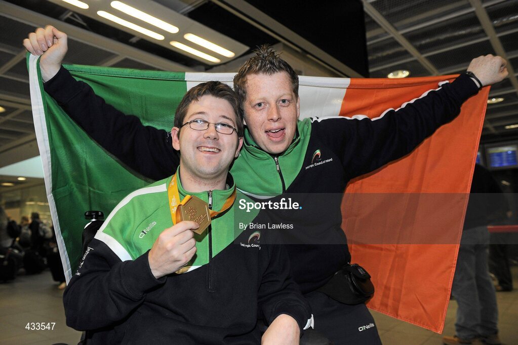 10 June 2010; Padraic Moran, from Bray, Co. Wicklow, celebrates with his on court assistant Robert Roe, from Bray, on his return to Ireland after winning Gold in the BC1 Class at the CPISRA World Boccia Championships in Lisbon. The Bray local, sensationally beat home favourite Portugal’s Joao Paolo Fernandez by a score of 3:2 in a thrilling final at the Estádio Universitário in Lisbon’s University complex to take victory This is the end of a long Championship for Moran who earlier in the week led the Irish team to a 4th place finish in the BC1/BC2 combined team competition. Dublin Airport, Dublin. Picture credit: Brian Lawless / SPORTSFILE