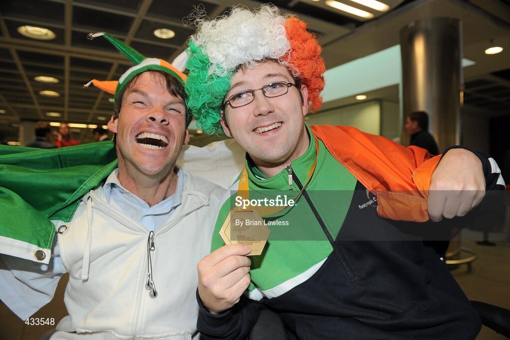10 June 2010; Padraic Moran, from Bray, Co. Wicklow, celebrates with Beijing 2008 Paralympic Games Boccia Bronze medallist Gabriel Shelly, from Bagenalstown, Co. Carlow, left, on his return to Ireland after winning Gold in the BC1 Class at the CPISRA World Boccia Championships in Lisbon. The Bray local, sensationally beat home favourite Portugal’s Joao Paolo Fernandez by a score of 3:2 in a thrilling final at the Estádio Universitário in Lisbon’s University complex to take victory This is the end of a long Championship for Moran who earlier in the week led the Irish team to a 4th place finish in the BC1/BC2 combined team competition. Dublin Airport, Dublin. Picture credit: Brian Lawless / SPORTSFILE